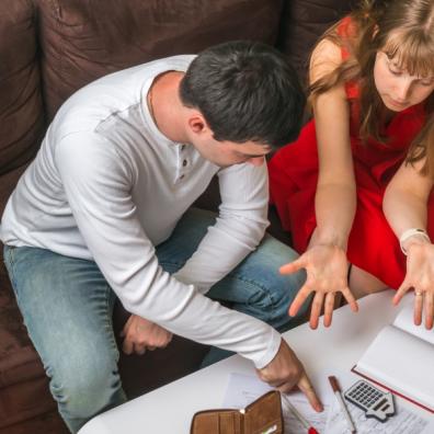 picture of a couple looking at their family budget