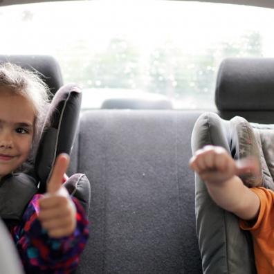 picture of children sitting in the back of a car