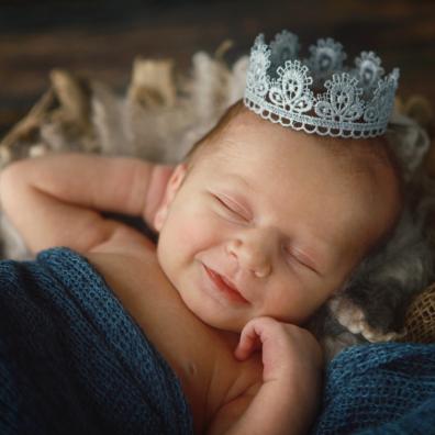 picture of a baby wearing a crown