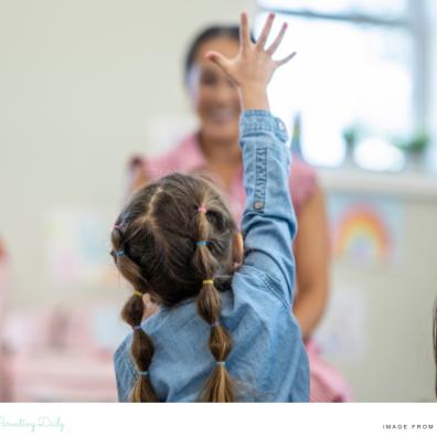 picture of a child putting her hand to to ask a question