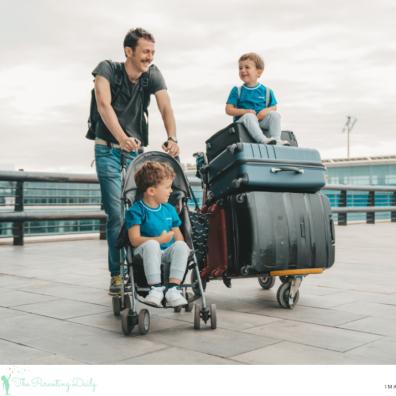 picture of a dad at an airport with his two children and lots of suitcases moving abroad