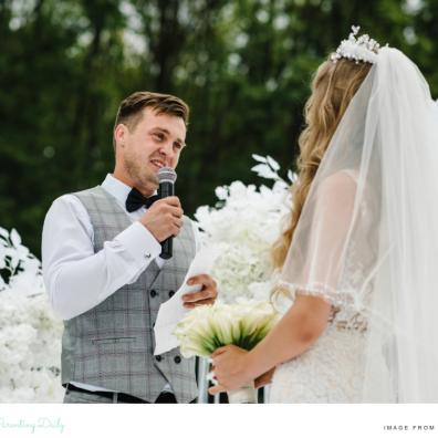 picture of a groom giving a speech to his wife on their wedding day