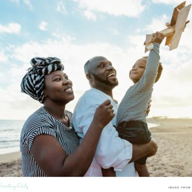 picture of a happy African family on a beach