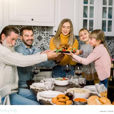 picture of a happy family having sunday lunch as part of a family tradition