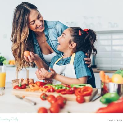 picture of a happy mum and child preparing a healthy nutritious meal together