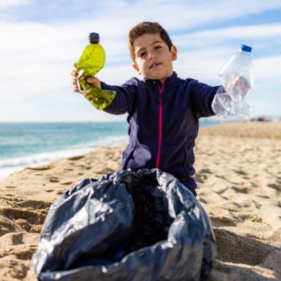 picture of a child doing a beach clean