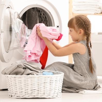 picture of a child doing the laundry