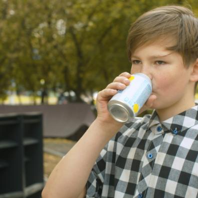picture of a child drinking a can of energy drink