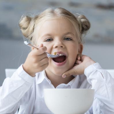 picture of a child eating breakfast