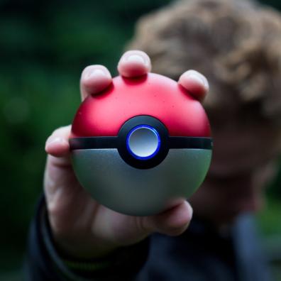 picture of a child holding a pokemon ball