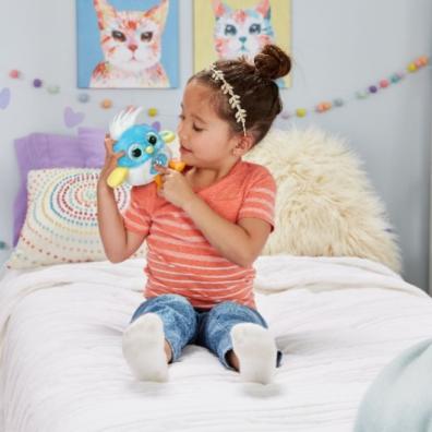 picture of a child in her bedroom playing with a LoLibird vtech toy