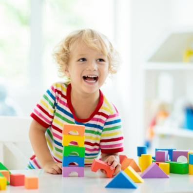 picture of child playing with colourful blocks