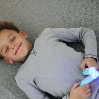 picture of a child using Stix Mindfulness Remotes
