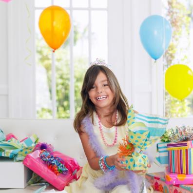 picture of a child with birthday presents