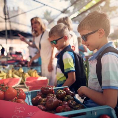 picture of children buying locally produced food