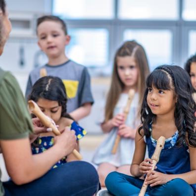 picture of children learning to play the recorder