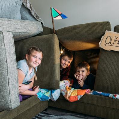 picture of children making an indoor den