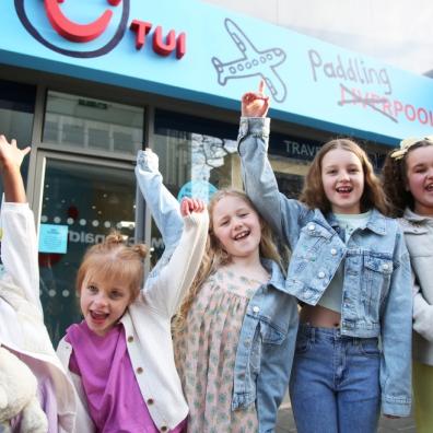 picture of children outside TUI travel agent