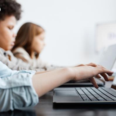picture of children using computers in school