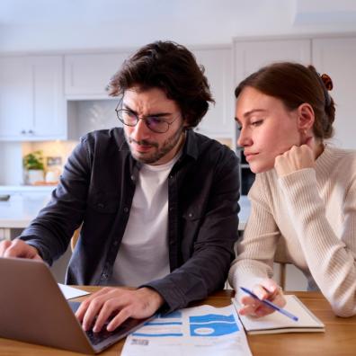 picture of a couple looking at household bills
