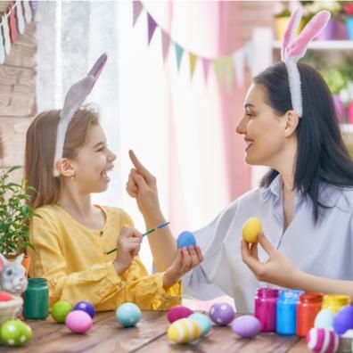 picture of mum and daughter painting easter eggs