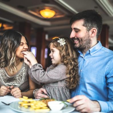 picture of a family eating in a restaurant
