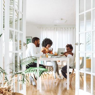 Picture of a family eating at a table in their family home