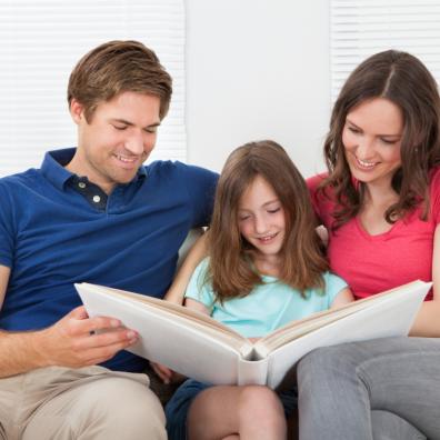 picture of a family looking at a photo album