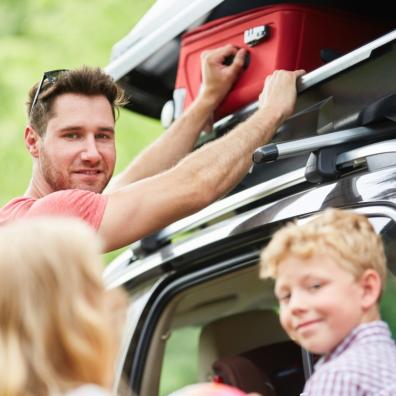 picture of family packing car for holiday