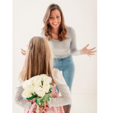 picture of girl giving her mum flowers