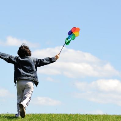 picture of happy child running outside