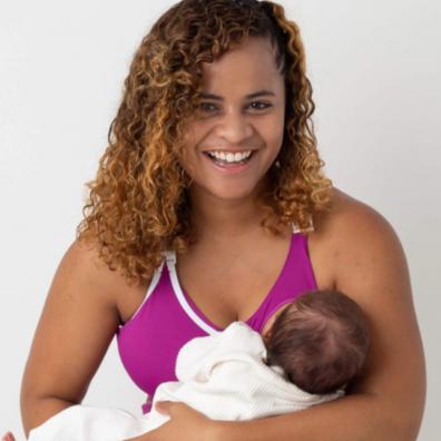 Picture of a mum breastfeeding wearing a latched nursing sports bra