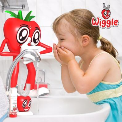 picture of next generation wiggle toothbrush in a a bathroom with a little girl brushing her teeth