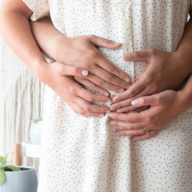 picture of pregnant woman holding her bump