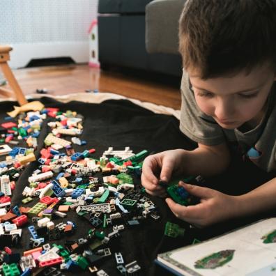 Picture of a child playing with lego blocks