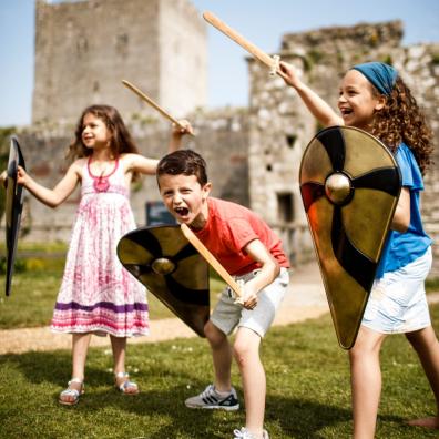 picture of kids roleplaying at castle ruins