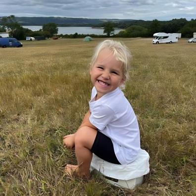picture of a child using a potette fold n go potty at a festival