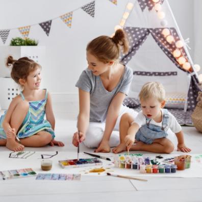 Picture of a mum painting with her children