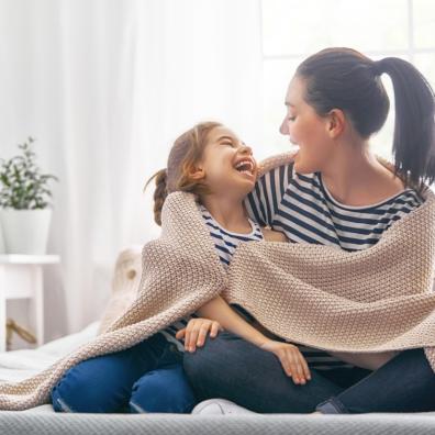 picture of mum and child wrapped in blanket