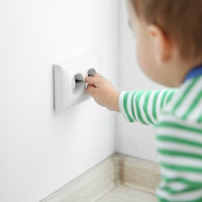 picture of a toddler with a plug socket
