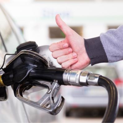 picture of someone putting fuel in their car