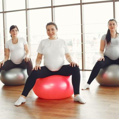 three women exercising while pregnant