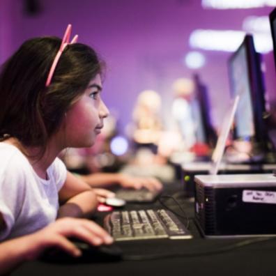 picture of a child gaming at power up event