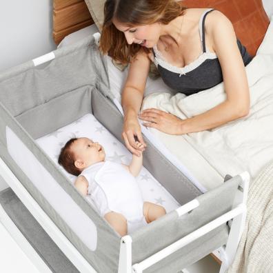 picture of a baby in a snuzpod bedside crib