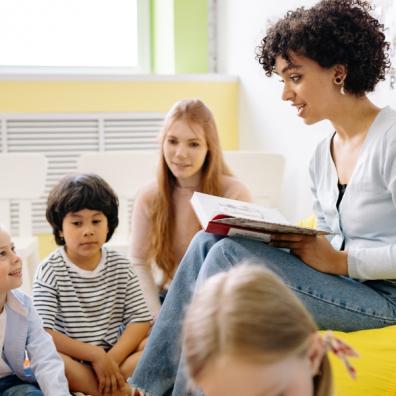 picture of teacher reading to primary children