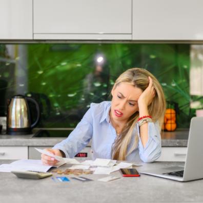 picture of a woman struggling with bills