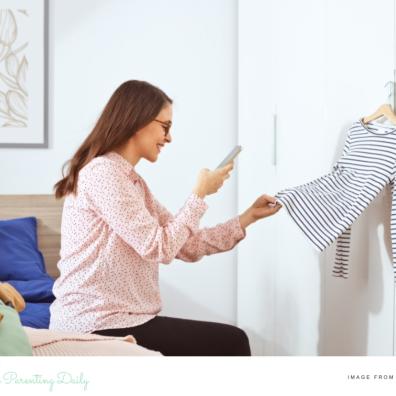 woman taking pictures of clothes to sell online picture of a woman taking pictures of clothes to sell online