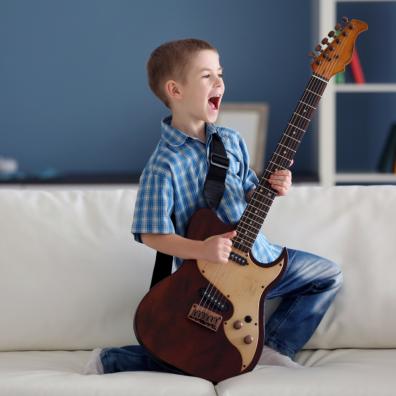 picture of a child playing the guitar