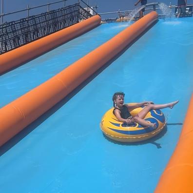 picture of a child going down the Mammoth slip and slide at Greendale Exeter